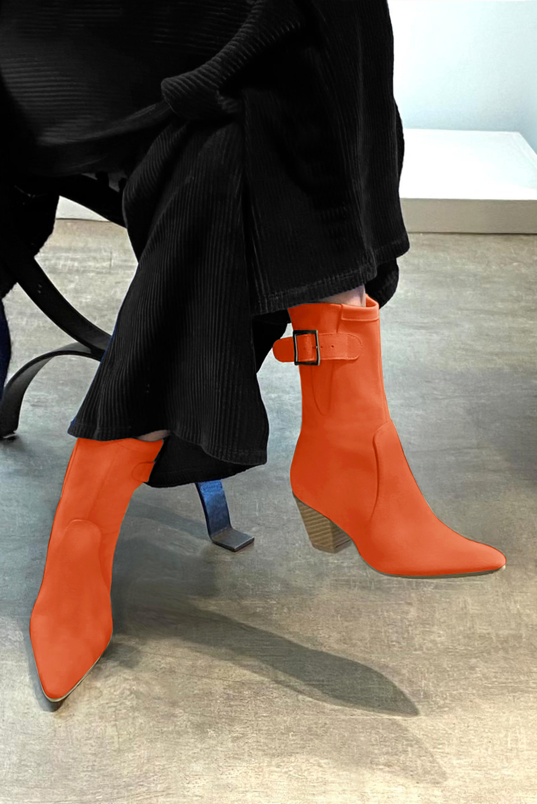 Clementine orange women's ankle boots with a zip on the inside. Tapered toe. Medium cone heels. Worn view - Florence KOOIJMAN